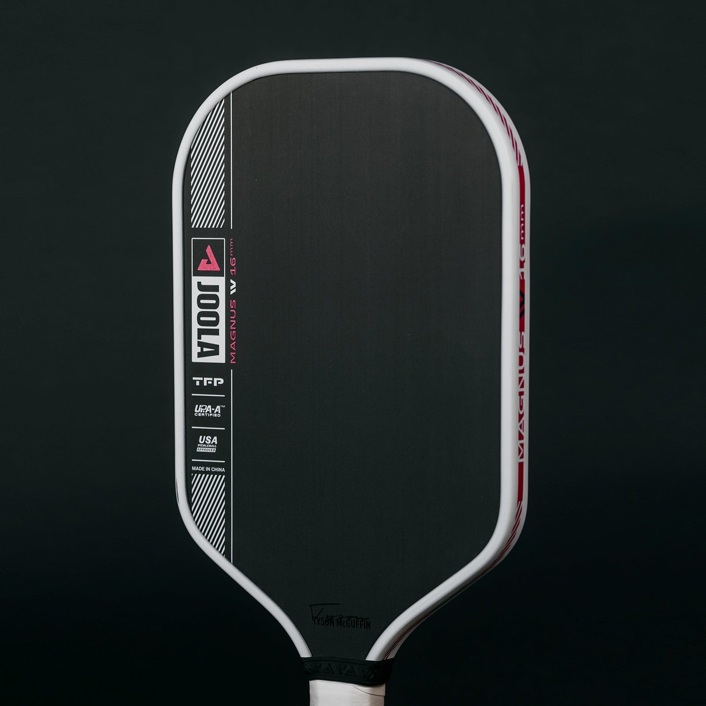 Black background, product image of the JOOLA Tyson McGuffin Magnus Pro IV Pickleball Paddle.