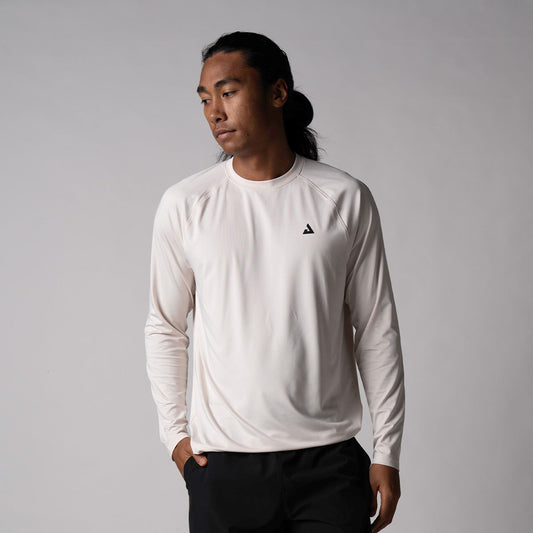 Gray Background, image of a male model wearing the JOOLA men's court long-sleeve shirt, sandstone.