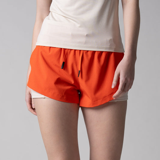 Gray background, image of a pair of JOOLA women's court 2 in 1 shorts, poppy red.