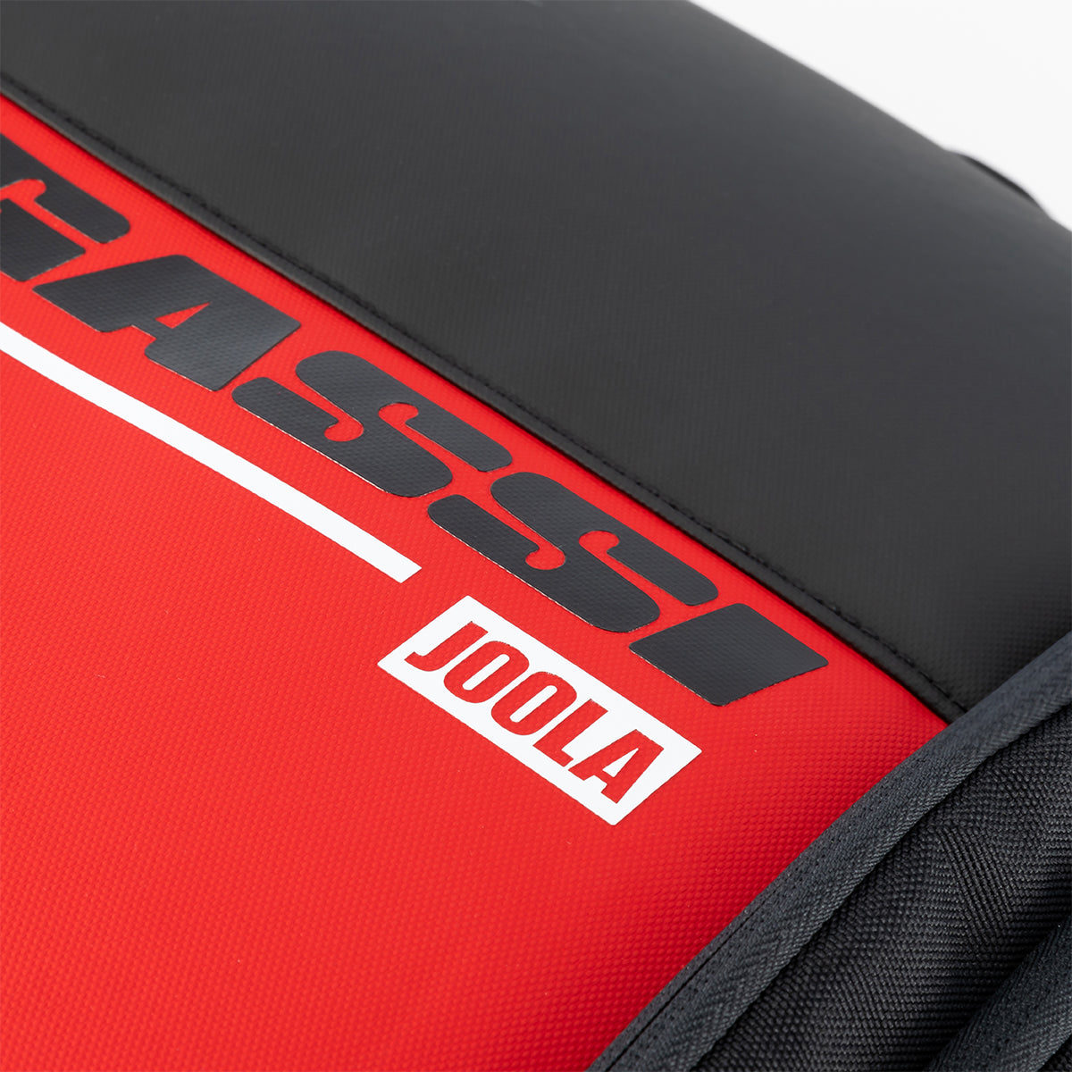 Close up on the red, black and white Agassi x JOOLA word mark on the Agassi Vision II deluxe backpack.