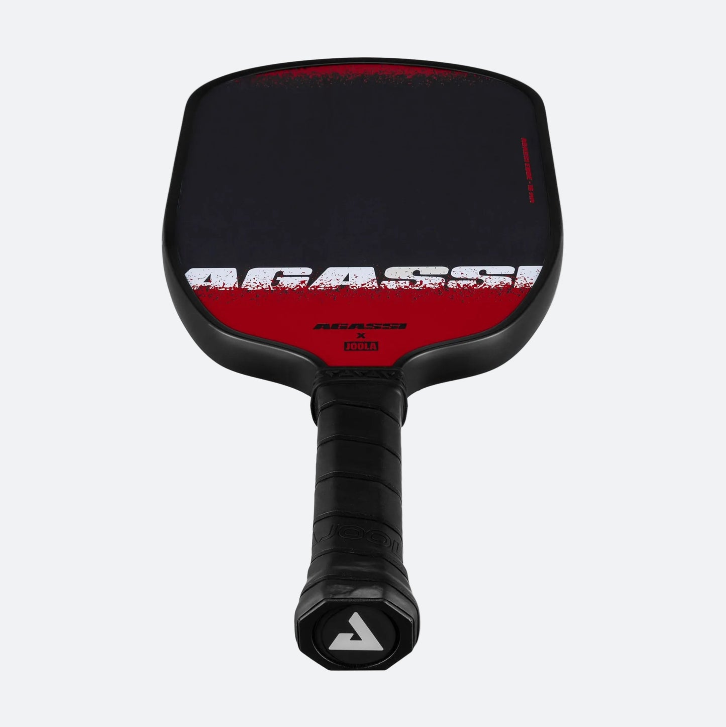White background, product image of the Agassi x JOOLA Agassi Edge pickleball paddle showing the JOOLA trinity logo on the paddle's end cap.