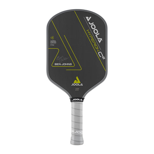 White Background Image: Ben Johns Hyperion C2 Pickleball paddle. Black surface with yellow lines and Ben Johns' signature. Grey handle and grey edge guard with white JOOLA logo.