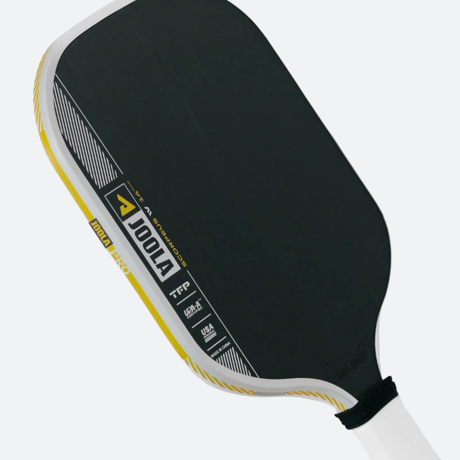 White background, close up image of the yellow, white and black edge guard on the JOOLA Anna Bright Scorpeus Pro IV Pickleball Paddle. 14mm.