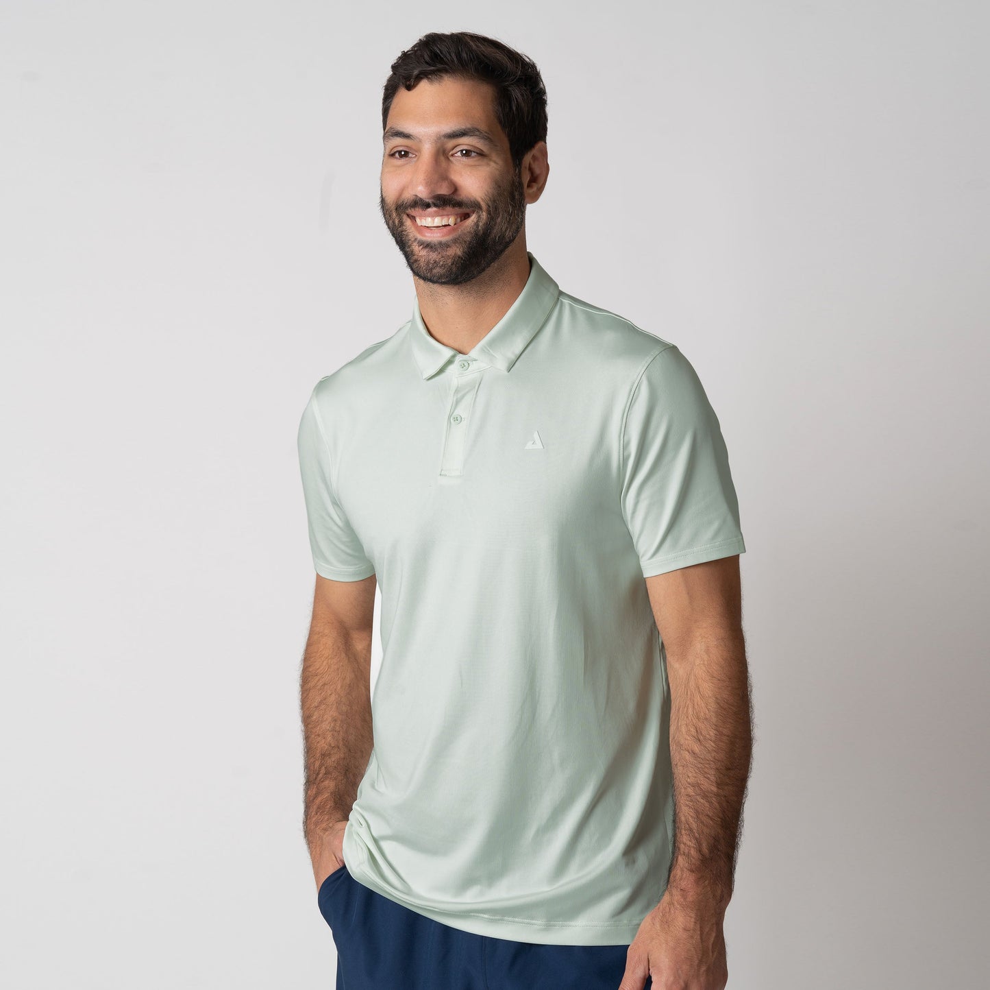 Image showing a male model wearing a JOOLA men's club polo, hushed mint.