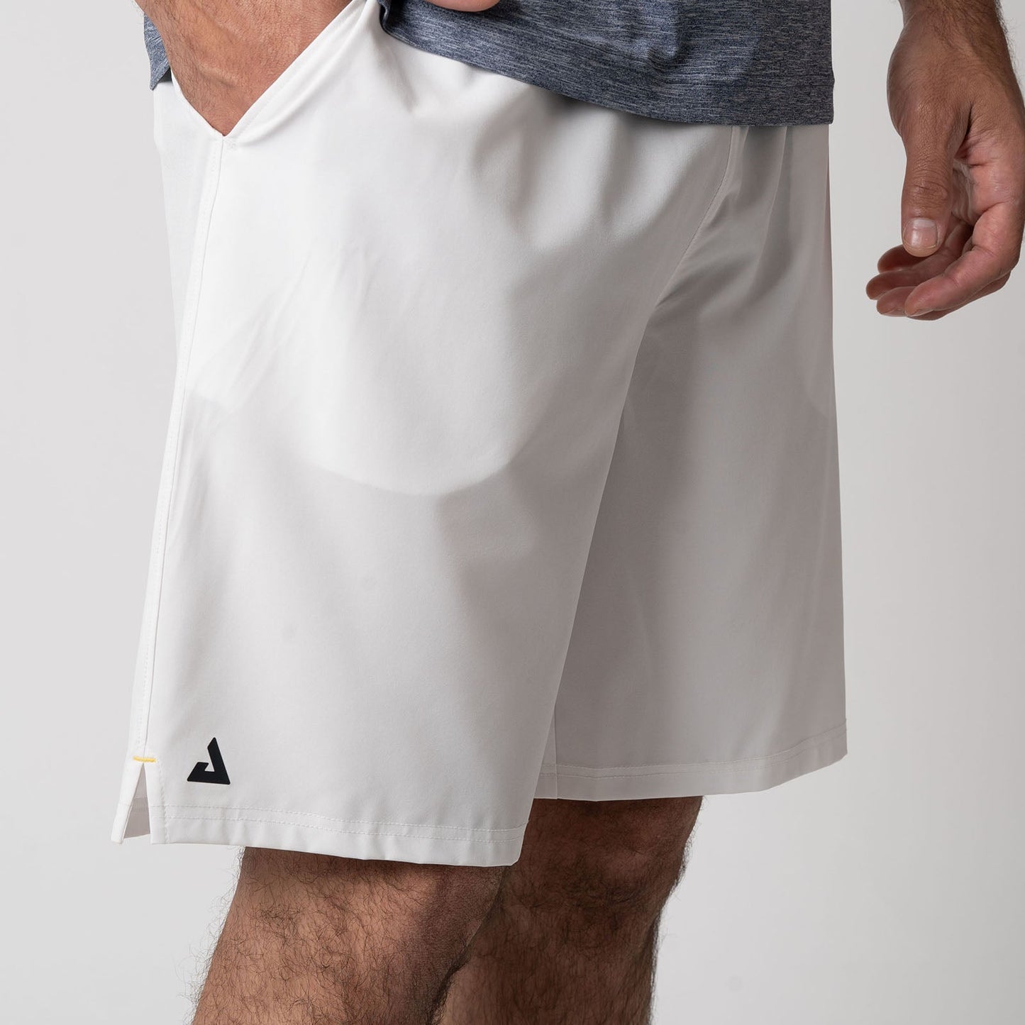 Side profile of a pair of JOOLA Men's Woven Shorts with a nine-inch inseam, white.