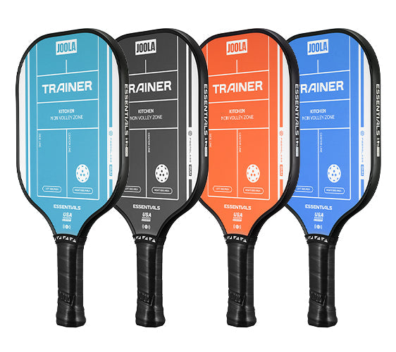 White background, angled product image of four JOOLA Trainer pickleball paddles. Blue, Orange, Teal and Black.